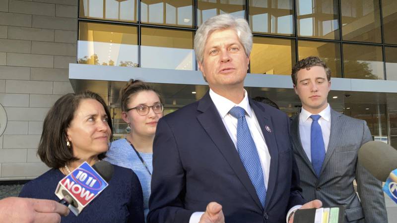 FILE - Rep. Jeff Fortenberry, R-Neb., center, speaks with the media outside the federal...