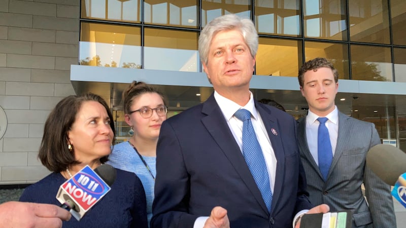 FILE - Rep. Jeff Fortenberry, R-Neb., center, speaks with the media outside the federal...