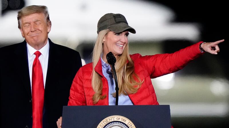 Sen. Kelly Loeffler, R-Ga., speaks as President Donald Trump listens during a campaign rally...